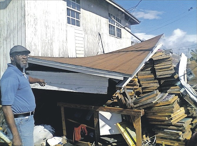 Proprietor Leslie Williams is asking for the public’s assistance to rebuild his Southwest Screen Printing Shop, which has provided uniforms for a number of sporting organisations and schools for the past 30 years. Category 4 Hurricane Matthew left Williams’ printing shop on Key West Street and Cordeaux Avenue partly demolished with the structure from the bottom collapsed.                                    Photo: Brent Stubbs/The Tribune