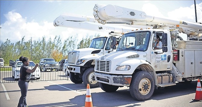 The newly arrived PowerSecure bucket trucks in Nassau yesterday. Photos: Shawn Hanna/Tribune Staff