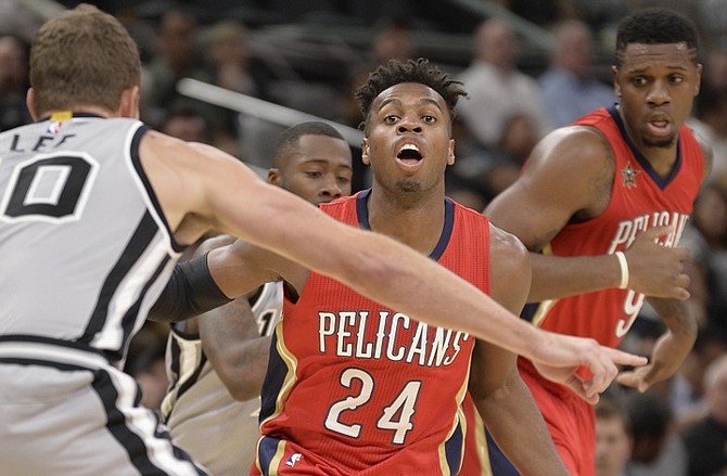 New Orleans Pelicans guard Buddy Hield (24) drives against San Antonio Spurs forward David Lee, left. (AP)