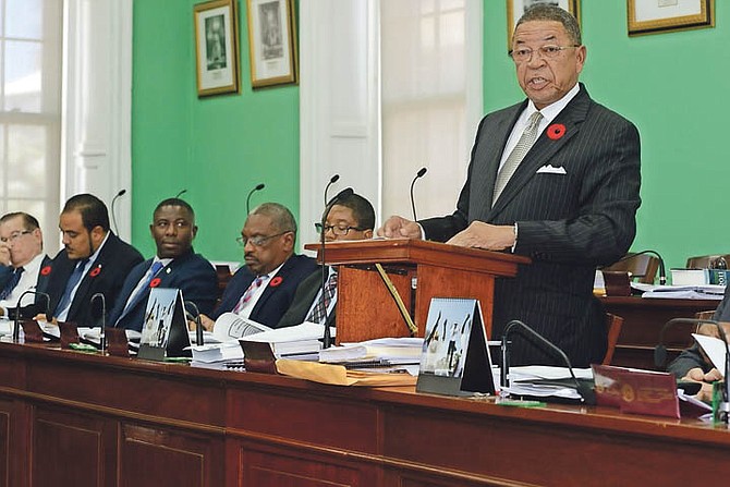 Hubert Chipman, Chairman of the Public Accounts Committee, presents the Majority Report on the Urban Renewal Commission in the House of Assembly yesterday. 
Photo: Peter Ramsay/BIS
