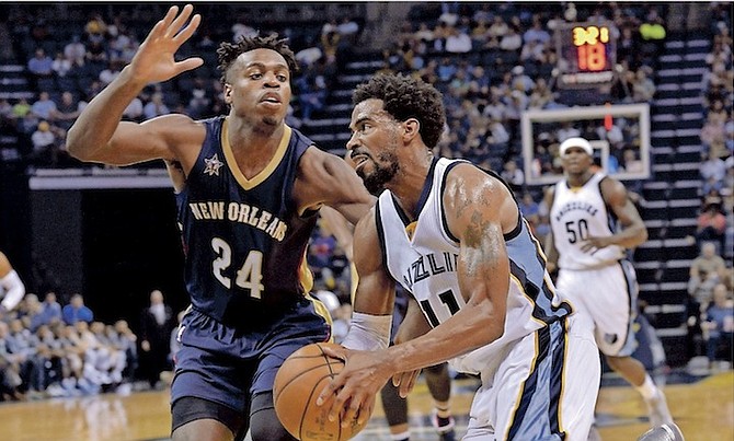 Grizzlies guard Mike Conley (11) drives against New Orleans Pelicans guard Buddy Hield (24) last night. (AP)
