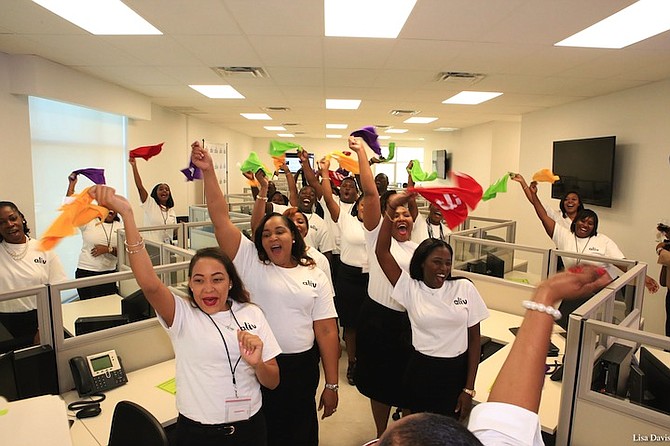 Colourful celebrations among the employees at NewCo's national call centre and administrative office in Freeport as the new mobile service brand 'aliv' is launched earlier this month. Photo: Lisa Davis/BIS