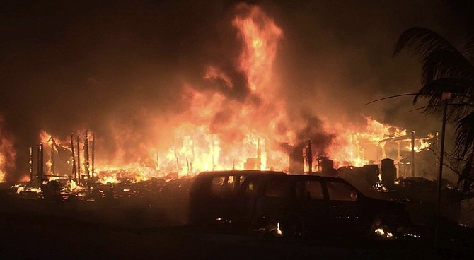 The massive fire destroyed four homes.