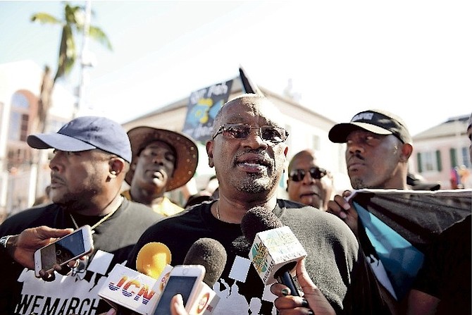 FNM leader Dr Hubert Minnis speaking during Friday’s protest in Rawson Square. 