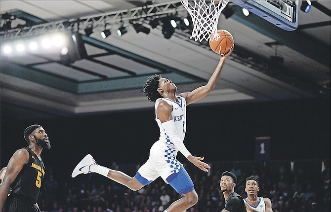 HANGTIME: The Kentucky Wildcats remained undefeated on the season with a dominant 115-69 win over the Arizona State Sun Devils in the inaugural Atlantis Showcase in the Imperial Arena of the Atlantis resort last night. 
       Photo: Shawn Hanna/The Tribune