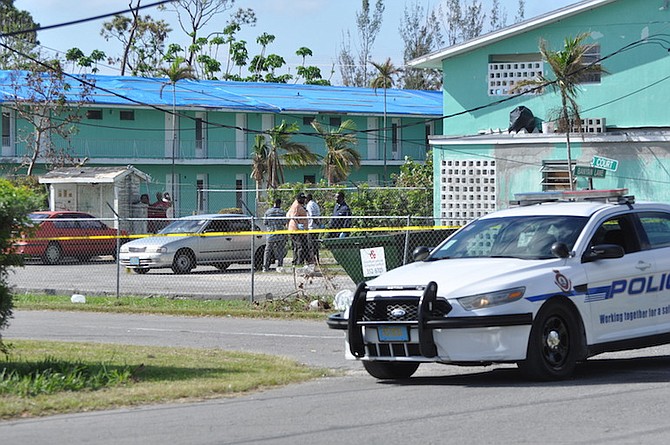 Police on the scene on Sunday morning in Freeport, where a man was found dead in a car. Photo: Vandyke Hepburn/BIS