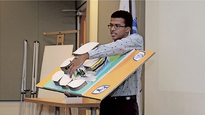Terrance Arnold, a student in the Faculty of Architecture at the University of The Bahamas, explain details of his group’s 3D model for the Expo 2020 Dubai design challenge. 
Photos: Azaleta Ishmael- Newry
