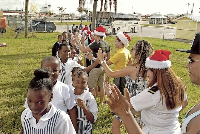 Some of the youngsters in Grand Bahama celebrating at the pre-Christmas party. 