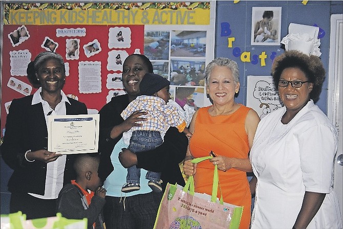 Karen Miller (second from left), who completed the course for the sake of her two sons, attends the breastfeeding graduation ceremony. Also pictured are Minister of Transport of Aviation Glenys Hanna-Martin (second from right) and members of the BNBA.
