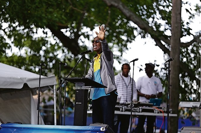 Archdeacon James Palacious addresses supporters at the Majority Rule gospel concert on Tuesday, saying "We live in a society where the rich gets richer and the poor get children". Photo: Terrel W Carey/Tribune Staff