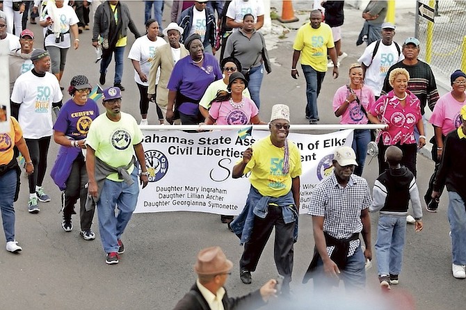 Some of those taking part in the march to mark the 50th anniversary of Majority Rule. Photo: Terrel W. Carey/Tribune Staff