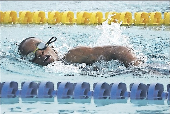 MAKING A SPLASH: An aspiring swimmer competes in the Swift/Gunite Heptathlon Meet at the Betty Kelly Kenning Swim Complex on Saturday. 
Photo: Shawn Hanna/The Tribune
