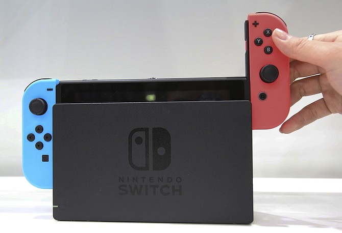 THE Nintendo Switch is a console that also serves as a hand-held gaming device. (AP)
