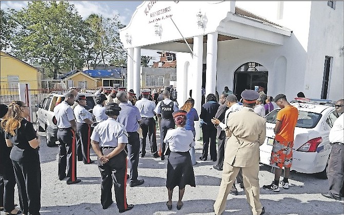 The Royal Bahamas Police Force and church leaders held a walkabout in the Kemp Road area yesterday. Due to the recent homicides in the area, church leaders said prayers and anointing were needed for the community. 
Photo: Terrel W. Carey/Tribune Staff