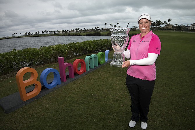 Brittany Lincicome with the Pure Silk-Bahamas LPGA Classic Trophy after her playoff victory over fellow American Lexi Thompson on Sunday