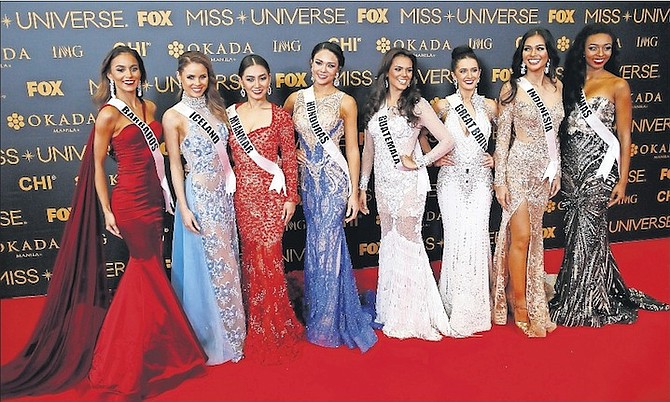 Cherell Williamson of Bahamas (far right) joins her fellow Miss Universe contestants on the red carpet in Manila, the Philippines, on Sunday night. AP Photo/Bullit Marquez