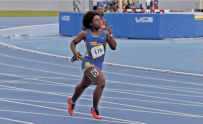 FAST TRACK: A young athlete competes on Saturday during the 14th Annual Club Monica Track and Field Classic at the Thomas A Robinson National Stadium. A number of athletes met the qualifying standards for the CARIFTA Games.
Photo: Terrel W Carey/Tribune Staff
