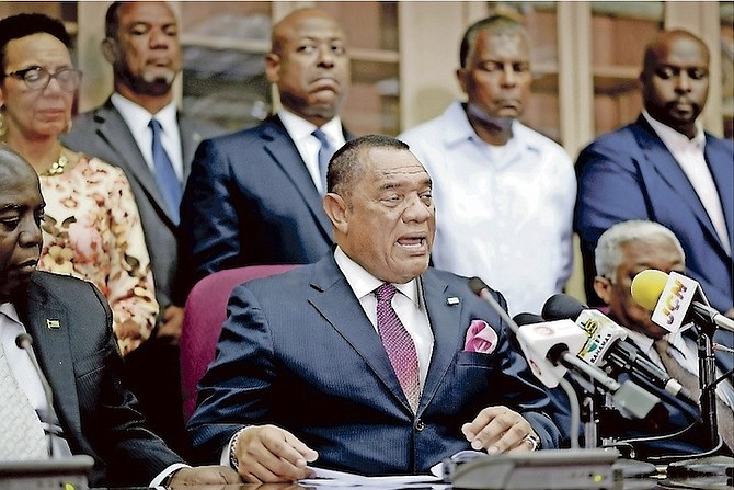 The Prime Minister surrounded by his ministers at his national address on Baha Mar’s sale in August. Photo/Shawn Hanna