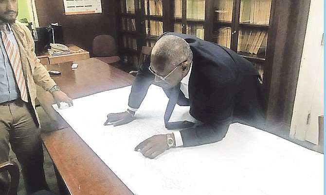 FNM leader Dr Hubert Minnis examines the new constituency map.