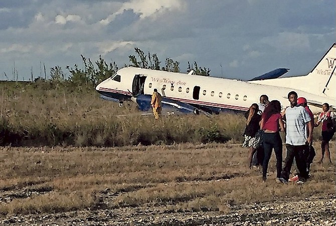 The scene on Tuesday after a Western Air plane crash landed at Grand Bahama International Airport. 