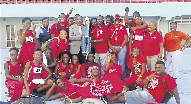 CHAMPIONS: The CR Walker Knights celebrate yesterday after winning the Government Secondary Schools Sports Association Senior Track and Field Championships.