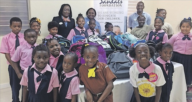 Children from Gambier Primary School who have been provided with new backpacks by the Sandals Foundation. 
