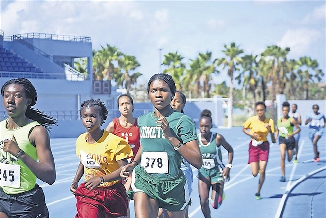 LEADER OF THE PACK: Athletes compete yesterday on day one of the BAISS Track and Field Championships at the Thomas A Robinson National Stadium.
