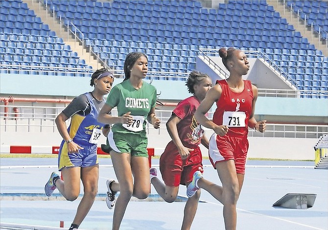 CRUISE CONTROL: High school students compete on day two of the BAISS Track and Field Championships at the Thomas A Robinson National Stadium.
Photo: Terrel W Carey/Tribune Staff