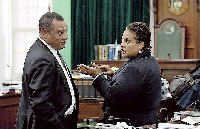 Prime Minister Perry Christie speaking to Leader of the Opposition Loretta Butler-Turner in the House of Assembly Wednesday. 
Photo: Shawn Hanna/Tribune Staff