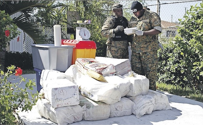 The Drug Enforcememt Unit conducted a search of a home in the Boatswain HIll area of Carmichael Road where 20 plus bags including bins and cooler along with a scale were found and confiscated by police. Photo: Terrel W. Carey/Tribune Staff