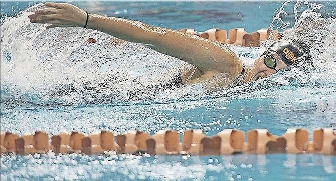 JOANNA EVANS in action at UT’s Lee and Joe Jamail Texas Swimming Center on Saturday.