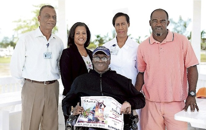 (L-R): Christopher Strachan, public relations officer at Sandilands Rehabiliation Centre (SRC); Dr Indira Grimes, SRC Geriatrics Ward consultant; Daniel Bastian, patron of the Push-a-thon; Sister Denise Smith, senior nursing officer in-charge of the Geriatrics Ward, and Shervin Brown, Mr Bastian’s pusher and porter at the SRC Pharmacy. 
