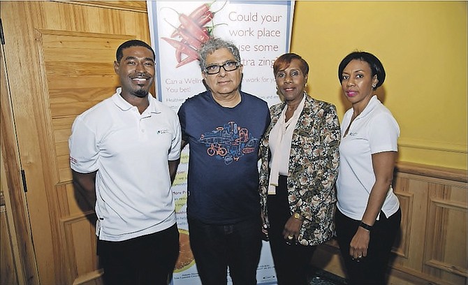 Employees from Atlantic Medical pose for a photo with Dr Deepak Chopra and Lynda Gibson,  Atlantic Medical’s executive vice president and general manager.