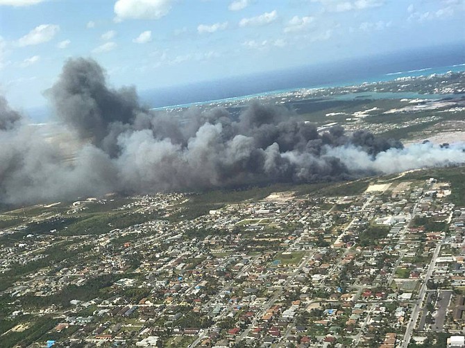 Smoke billows across New Providence on Sunday afternoon after fire broke out at the city dump