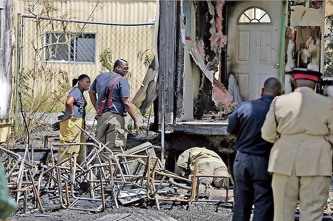 A fire started at the rear of AF Adderley Junior High School. Photo: Terrel W. Carey/Tribune Staff
