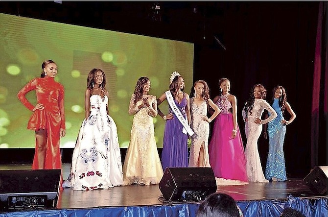 
Contestants pose for a photo with the newest Miss Univeristy of the Bahamas Leadership Pageant winner. 
