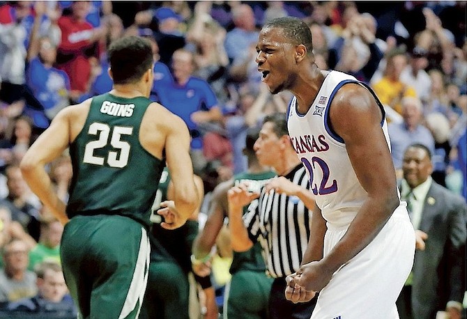Michigan State’ Kenny Goins (25) jogs to the bench as Kansas’ Dwight Coleby (22) celebrates late in the second half of a second-round game in the men’s NCAA college basketball tournament.
