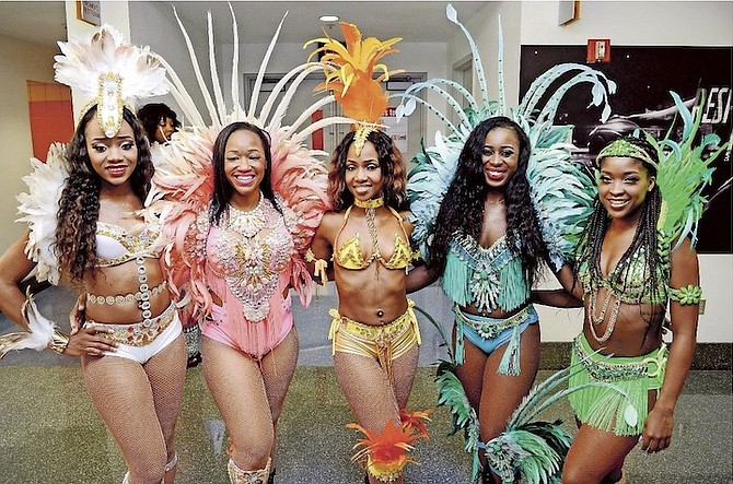 Bahamas Junkanoo Carnival dancers share a few smiles as the Bahamas took centre stage at the American Airlines Arena in a major sports tourism campaign for the third consecutive year.                                                                                                                               Photo: Antiro Riley