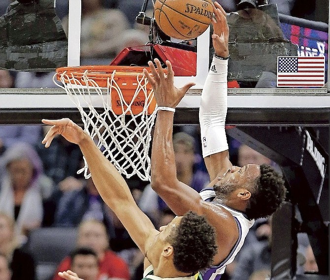 Kings guard Buddy Hield, right, goes to the basket against Bucks guard Malcolm Brogdon during the first half of Wednesday night’s game in Sacramento, California.
(AP Photo/Rich Pedroncelli)