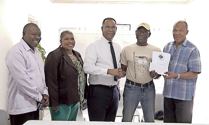 From left, administrator Jolton Johnson, administrator community health Charlene Bain, D. Michael Darville, contractor Gregory Higgs, PHA managing director Herbert Brown.