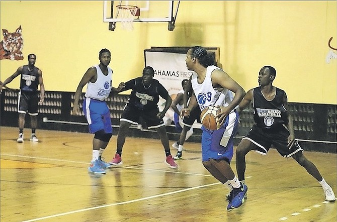ON THE REPLAY: The Breezes High Flyers dethroned defending champions Athletico Bahamas 77-51 to complete a 2-1 series edge on Saturday night.      
Photo: Terrel W Carey/Tribune Staff
