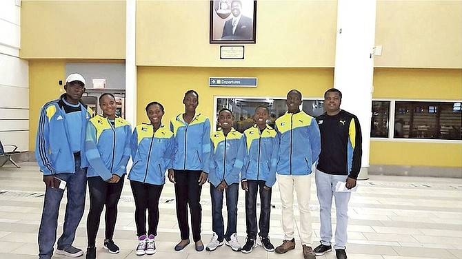 Coaches Bradley Bain (left) and Ricardo Demeritte (far right) with Junior Fed and Davis Cup team members Sydni Kerr, Sydney Clarke, Alana Mackey, Kofi Bowe, Denali Nottage and Donte Armbrister.