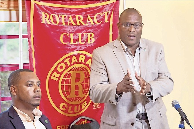 FNM candidate for Marco City Michael Pintard speaking at the Rotaract Club alongside DNA candidate Nevar Smith, seated. Photo: David Mackey
