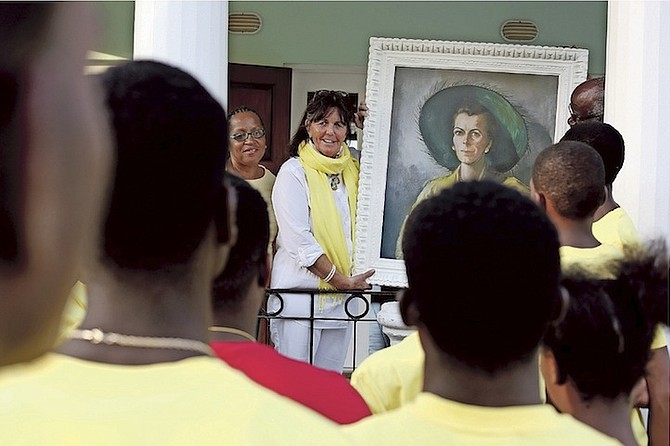The Ranfurly Home for Children held a portrait hanging of the founder, Hermione Ranfurly, whose daughter, Lady Caroline Simmonds, is pictured speaking with the children about her mother while holding the painting. Photos: Terrel W. Carey/Tribune Staff