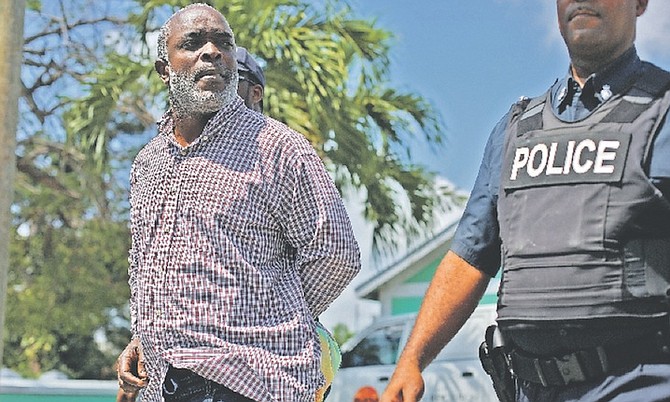 OMAR Archer is escorted to court on Tuesday morning. Photo: Terrel W Carey/Tribune Staff