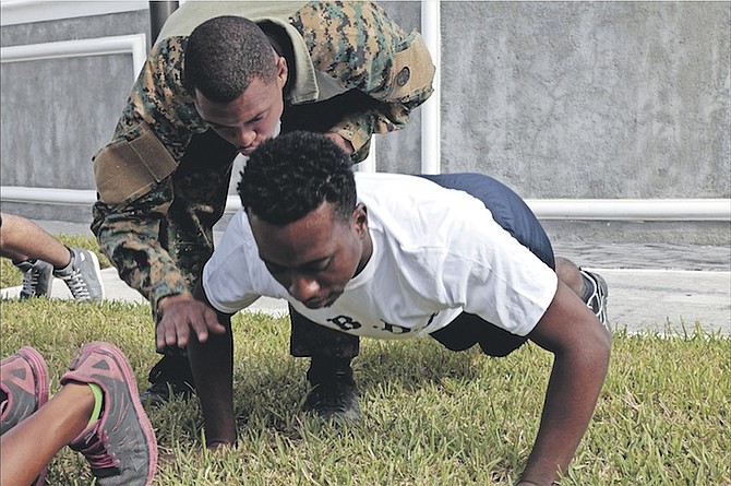 Tribune reporter Rashad Rolle is put through his paces in a physical test. Photos: RBDF
