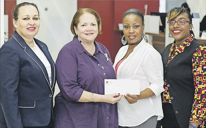 Glenda Whylly, senior manager, managing director’s office, CIBC FirstCaribbean presents Marcia Newball, executive director, REACH, and Tamika Collie, REACH volunteer, with a cheque donation along with Llakell Pratt, administrative co-ordinator, CIBC FirstCaribbean Harbour Bay Branch.