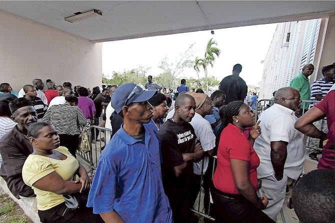People queuing at the Parliamentary Registration Department yesterday, the last day for voter registration for the 2017 general election. Photo: Kristaan Ingraham/BIS