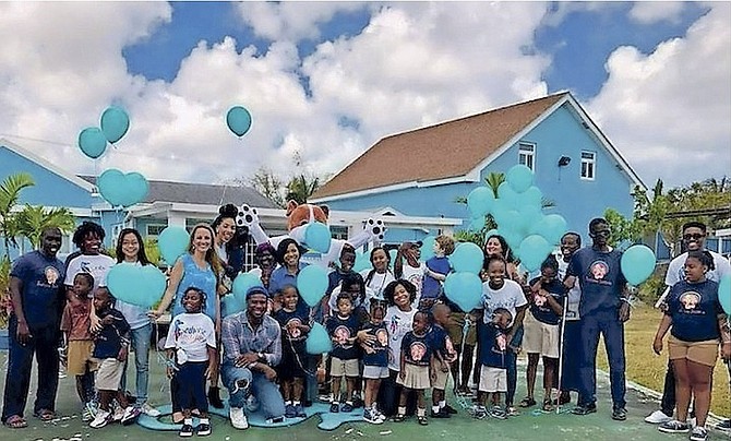 Corporate partners, staff and students pose for a quick group shot to kick-start Autism Awareness Month festivities.