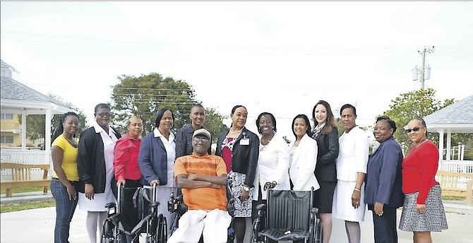 Push-a-thon patron Daniel Bastian (at centre) and Sandilands staff with wheelchairs donated by corporate Bahamas. Photo/Shawn Hanna